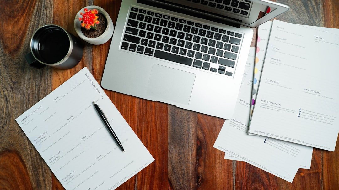 laptop desk financial documents