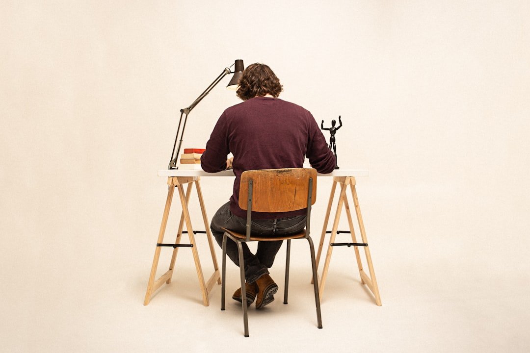person working on creative hobby at desk