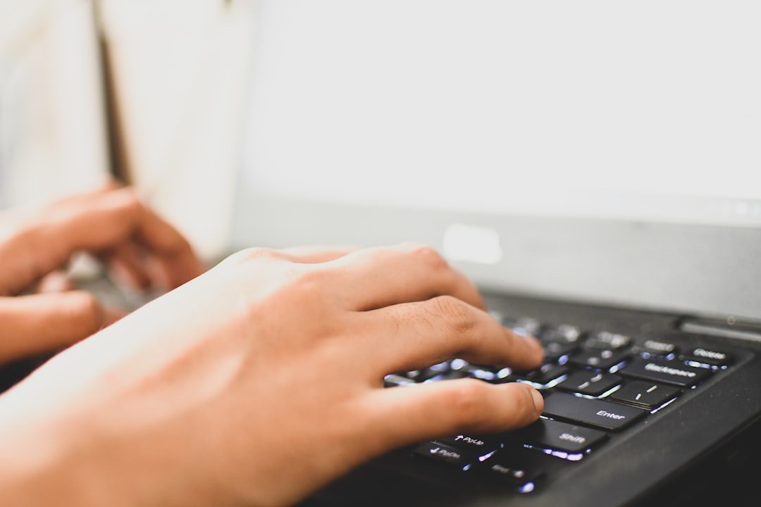 person typing keyboard notebook